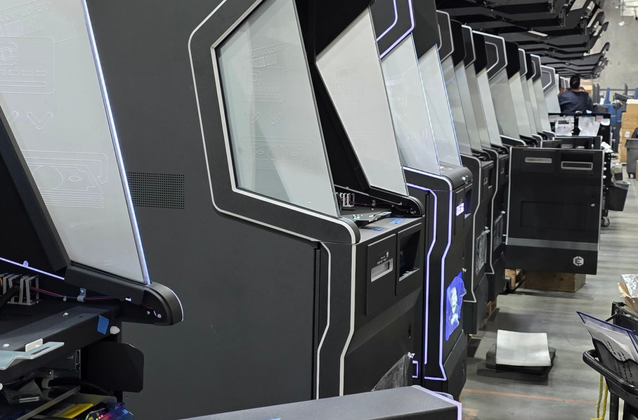 Row of gaming and kiosk cabinets in assembly on the Nevatronix production floor