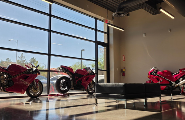 Nevatronix office lobby seating area beside sunlit floor-to-ceiling windows